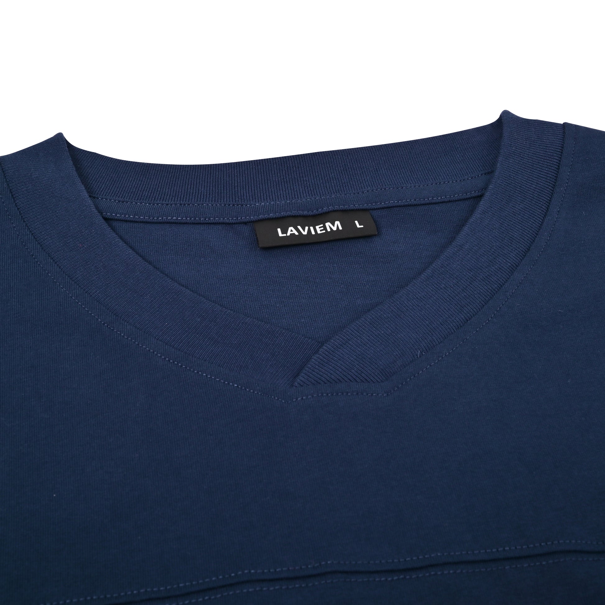 Close-up of a blue shirt with a LAVIEM label on a white background