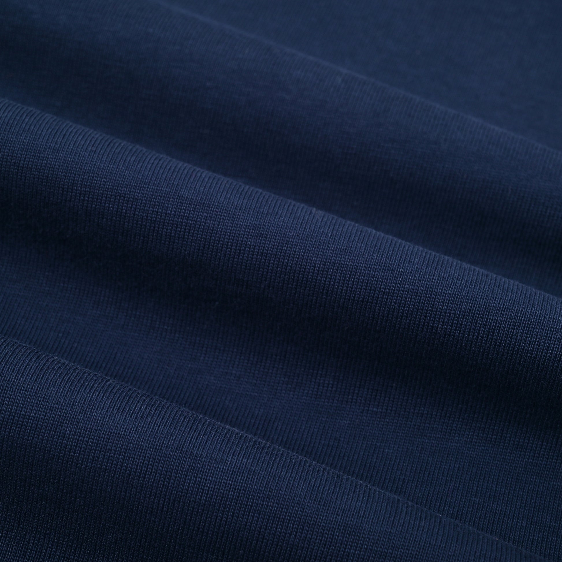 Close-up of dark blue fabric with visible texture