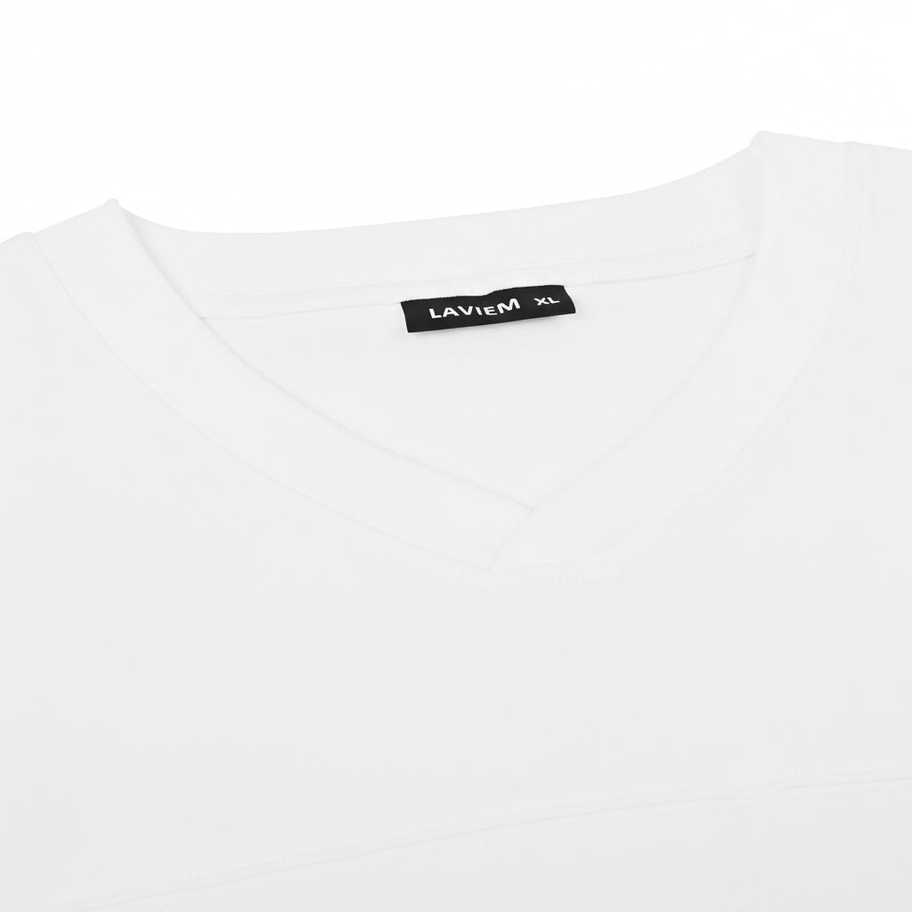 White t-shirt with a black label on a white background