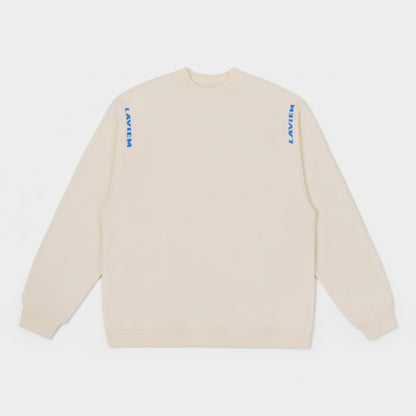 Beige sweatshirt with blue and black text on a white background