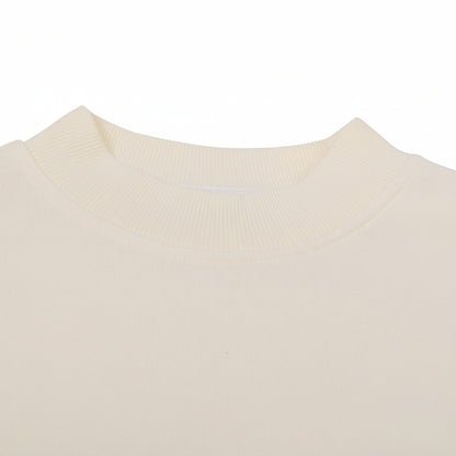 Close-up of a beige sweater with a collar on a white background
