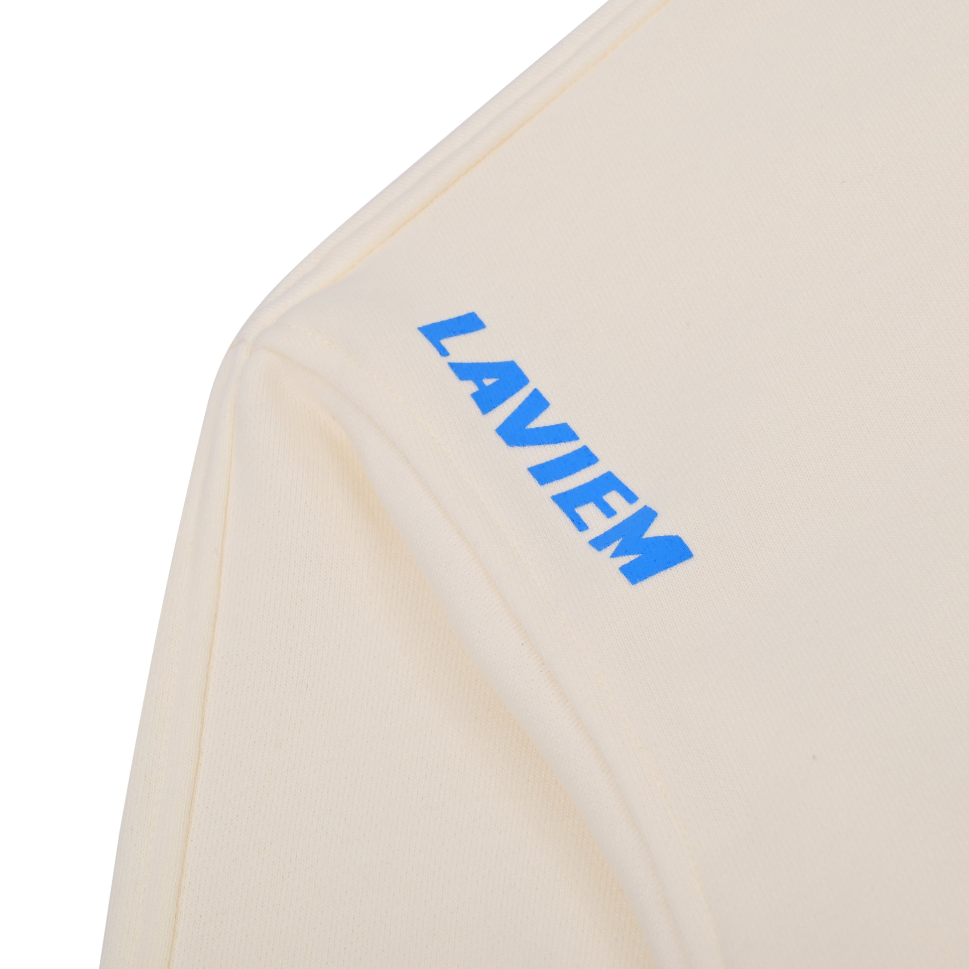 Beige towel with blue 'LAVIEM' logo on a white background