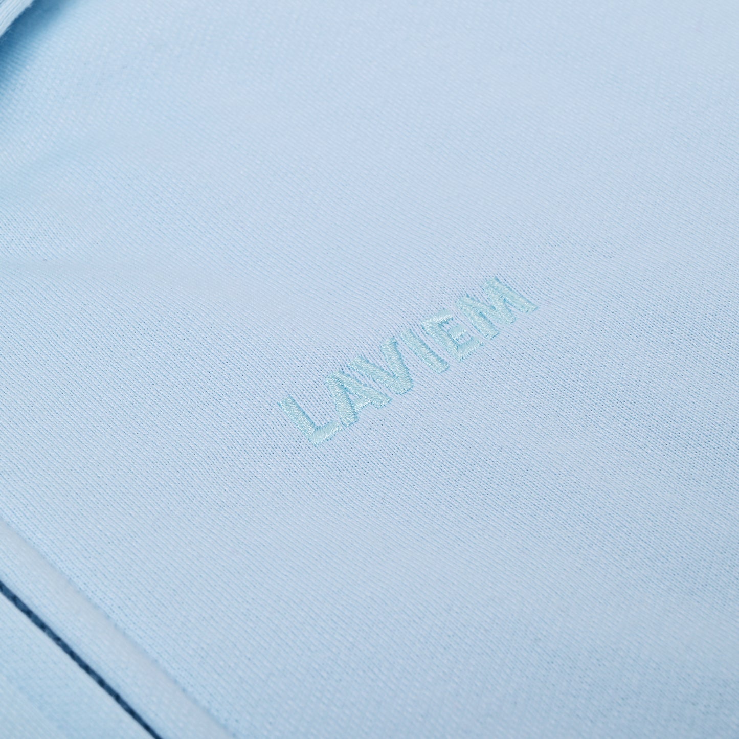 Close-up of a light blue product with 'LAVIEM' branding.