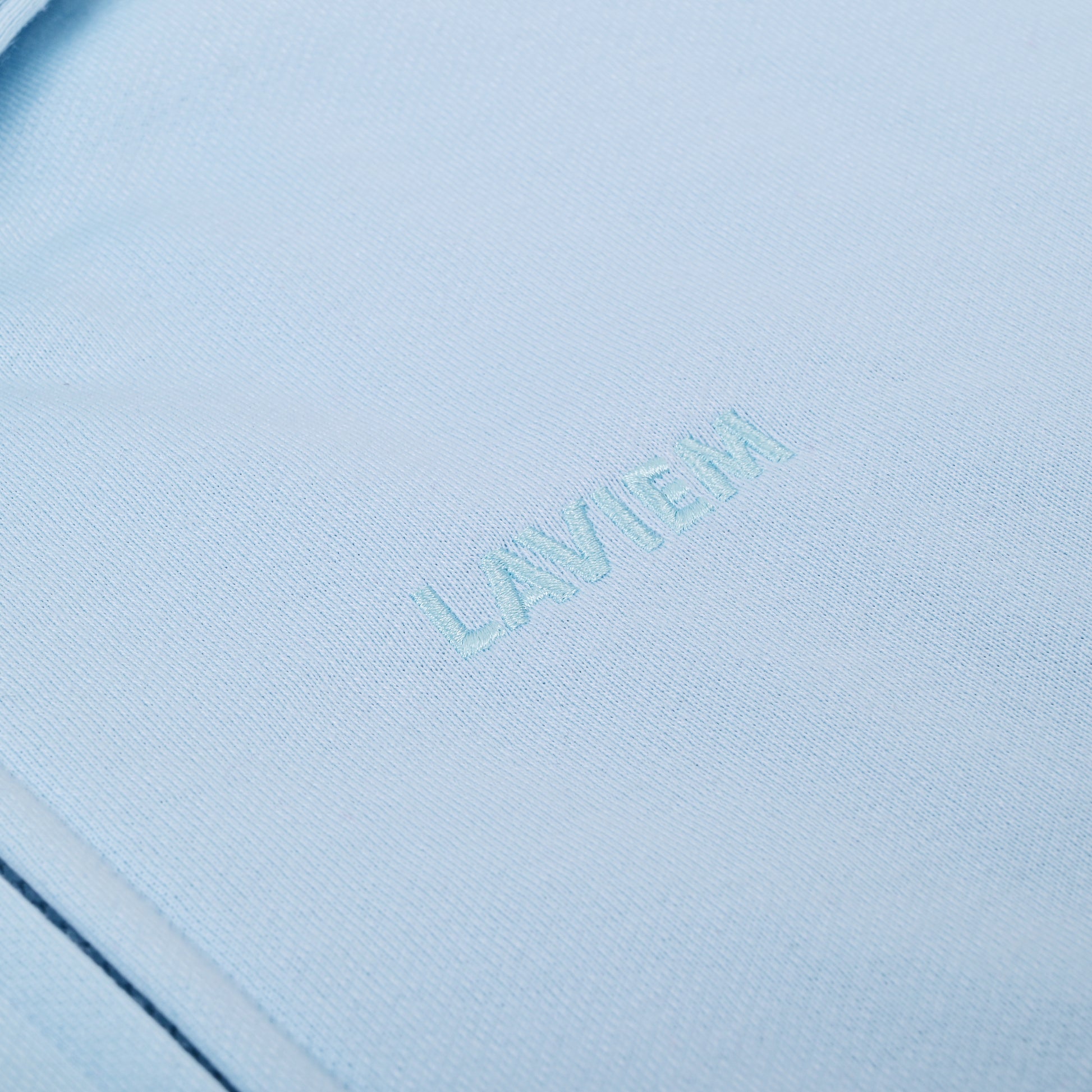 Close-up of a light blue product with 'LAVIEM' branding.